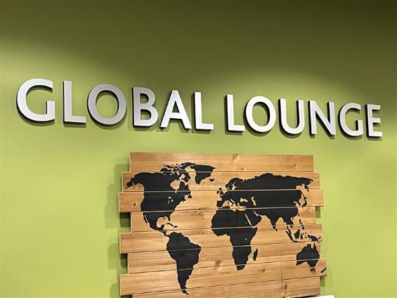 Global Lounge sign with world map